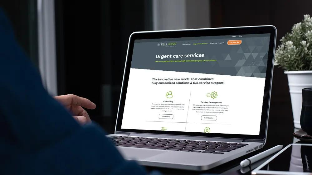 Laptop displaying the custom WordPress website LXE Digital developed for Intellivisit Solutions, an AI-powered healthcare company